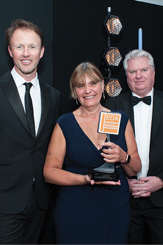 Tract-Hewett,-collecting-the-trophy-on-behalf-of-Paul-Gordon-from-Olympic-Fixing-Products-Ltd