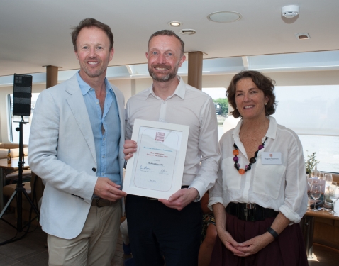 Paul White, CEO of the IBA, receives the award on behalf of Beata Kosciuszko, Electrical4Less Ltd. Paul White, CEO of the IBA, receives the award on behalf of Beata Kosciuszko, Electrical4Less Ltd.