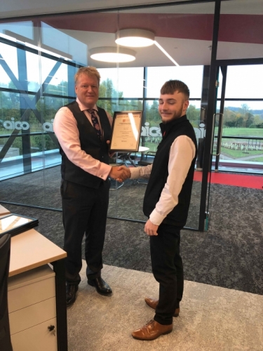 AICO Apprentice, Owen Terry, receiving his certificate from Managing Director, Neal Hooper