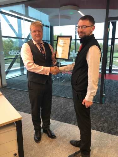AICO Apprentice, Kieran Smith, receiving his certificate from Managing Director, Neal Hooper