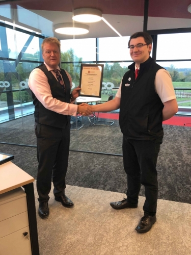 AICO Apprentice, Samuel Marston, receiving his certificate from Managing Director, Neal Hooper