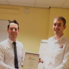 Ben Skidmore (r) of UK Spares, receiving his certificate from Manager Ross Graham (l)