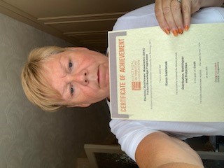Electrium's Karen Sambrook with her Credit certificate for her first module, Distribution