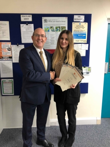 Peter Brittain, Edmundson Electrical Ltd, Wales & West Regional director presenting Tamara Morris with her certificate
