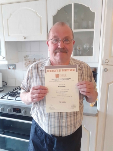 Electrium's Estimating Engineer, Kevin Pearson, with his Distinction certificate for his first module