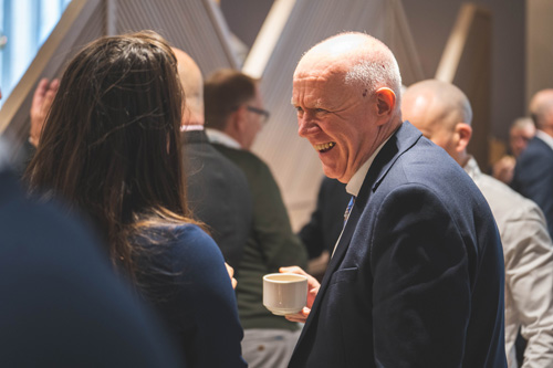 Delegates network over coffee