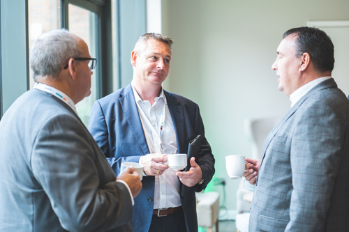 Delegates network over coffee