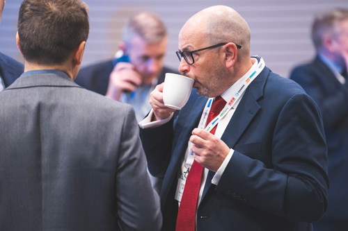 Delegates network over coffee