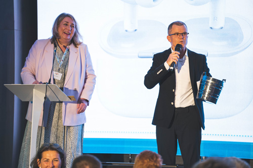 Dominic Holland & Anne Vessey present charity raffle prizes