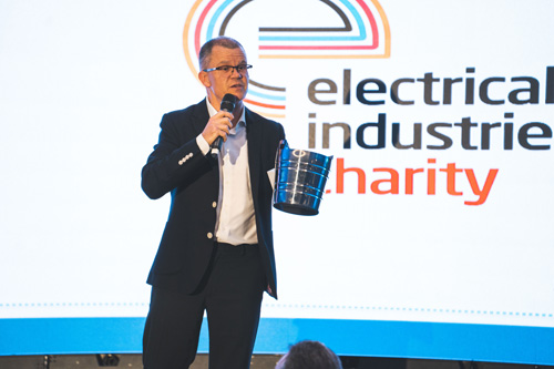 Dominic Holland presents charity raffle prizes