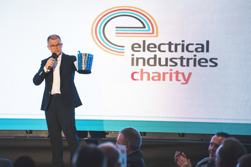 Dominic Holland presents charity raffle prizes