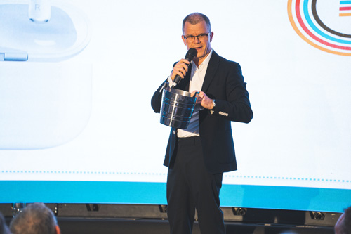 Dominic Holland presents charity raffle prizes