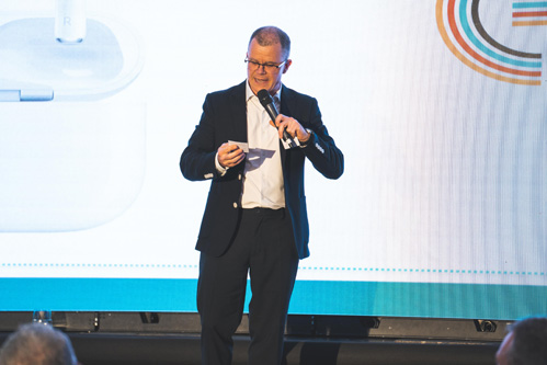 Dominic Holland presents charity raffle prizes