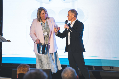 Dominic Holland & Anne Vessey present charity raffle prizes