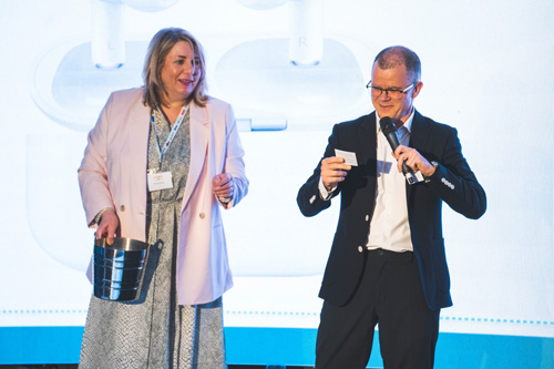 Dominic Holland & Anne Vessey present charity raffle prizes