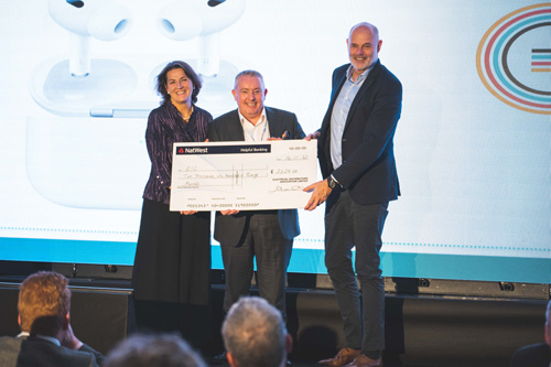 Margaret Fitzsimons & Chris Ashworth present cheque to the EIC 