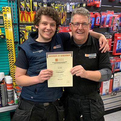Alex Bailey (l) with his Distinction in Distribution, Switchgear & Protection. Here with Manager, Alan.