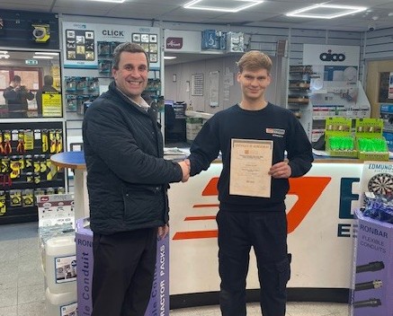 Alexander Svendsen being presented his first EDA  Product Knowledge Module: Introduction to the Principles of Electricity by Branch Manager, Dean Fada. Alexander has achieved a Distinction.