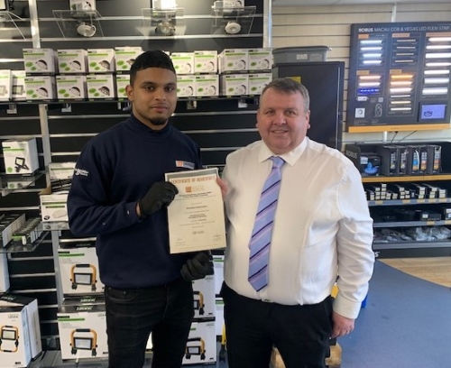 Danushyan Nallanathan, achieved a Distinction for his Product Knowledge Module: Introduction to the Principles of Electricity . Manager Andy Price handing Danushyan the certificate.