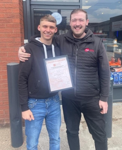 Paddy Hickey, Branch Manager at Flick Electrical Wholesale Ltd (SOLIHULL Branch) congratulating Eddie Jay for  achieving a Credit in his first Product Knowledge Module: Introduction to the Principles of Electricity.