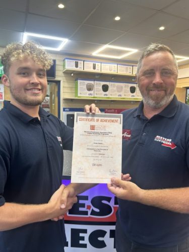 Finlay Deavin  being presented his first EDA  Product Knowledge Module: Introduction to the Principles of Electricity by Branch Manager, Andrew Pooley. Finlay has achieved a Distinction.