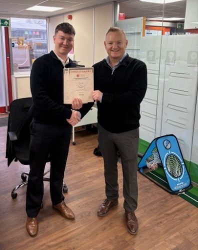 Henry Watts being presented his two EDA  Product Knowledge Module: Lighting (Intro) and Lighting (Systems)  by Branch Manager, Steve Rogers. Henry has achieved a Distinction in both.