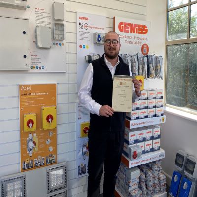 James Callow from Gewiss UK Ltd with his Distinction in Introduction to the Principles of Electricity