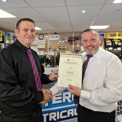 James Given awarding Jason Northey from Eastern Electrical his first certificate in the EDA Product Knowledge Module: Introduction to the Principles of Electricity 