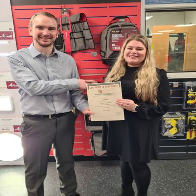 Katie Whiteley, achieved a Distinction for her Product Knowledge Module: Lighting (Introduction). Manager Dominic Harrison handing Katie the certificate.