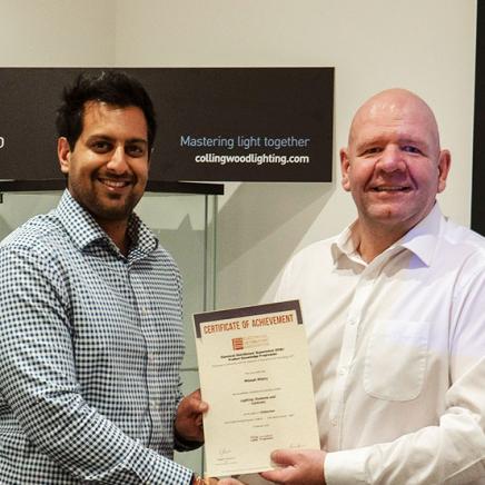 Mikesh Mistry, Internal Project Manager at Collingwood Lighting gets his Distinction certificate for Lighting Systems and Controls from Gareth Petley, Projects Sales Director. 