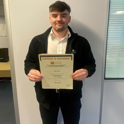 Owain Jones a Graduate Trainee at Edmundson Electrical Ltd (G A Nicholas Salford Branch) with his Distinction in the EDA Product Knowledge Module Distribution, Switchgear and Protection