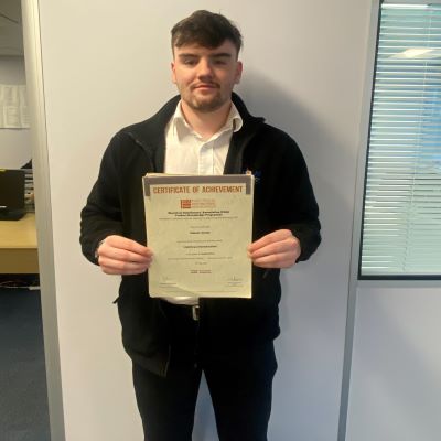 Owain Jones a Graduate Trainee at Edmundson Electrical Ltd (G A Nicholas Salford Branch) with his Distinction in the EDA Product Knowledge Module Lighting (Introduction) 