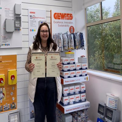 Rebecca Joyce from Gewiss UK Ltd with her Distinctions in both the Introduction to the Principles of Electricity and Lighting (Introduction) 