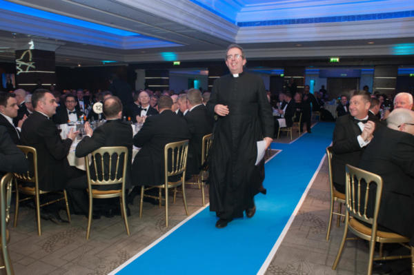 Rev Coles makes his way to the stage